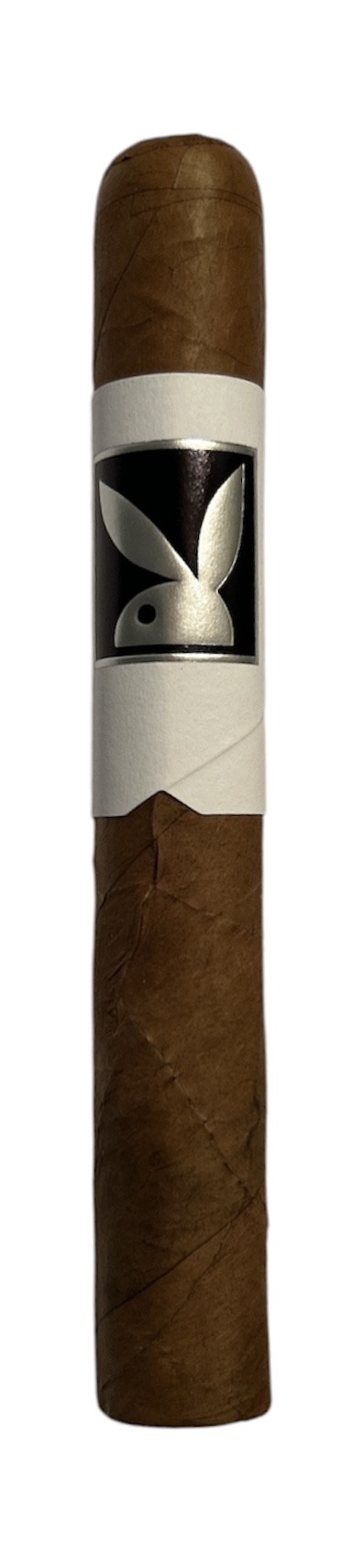 The Playboy x Kingmakers cigar standing upright, with a Playboy Bunny band